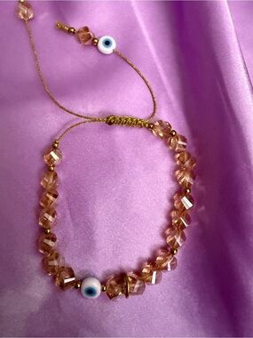 5/25 Gold Cord Pink Crystal Bracelet with Evil Eye Charm